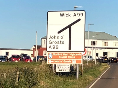 A sign with John OGroats