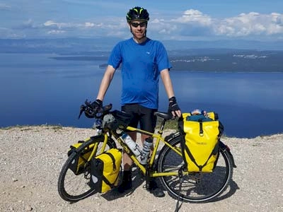 Stewart with his cycle touring bike on Island Cres