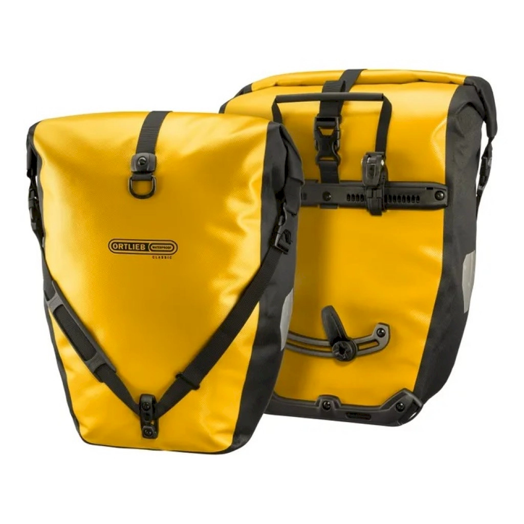 Two yellow Ortlieb Panniers stood net to each other.