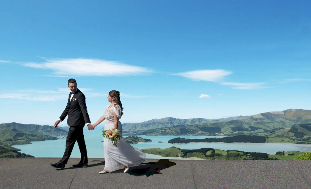 Zoe and Stewart, recently married, walking in front of John Jameson Lookout, near Sign of the Bell Bird, New Zealand