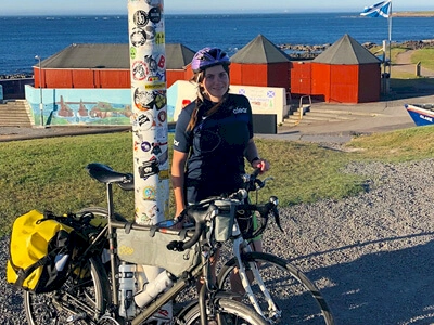 Zoe stood at the John O Groats sign
