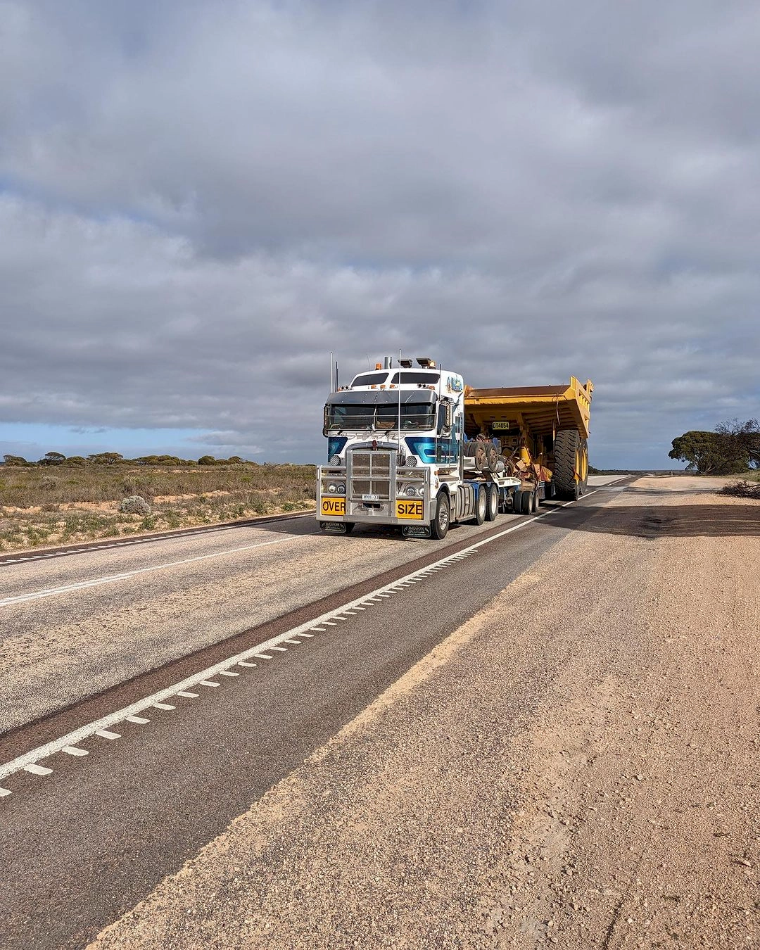dump truck being transported across Aus