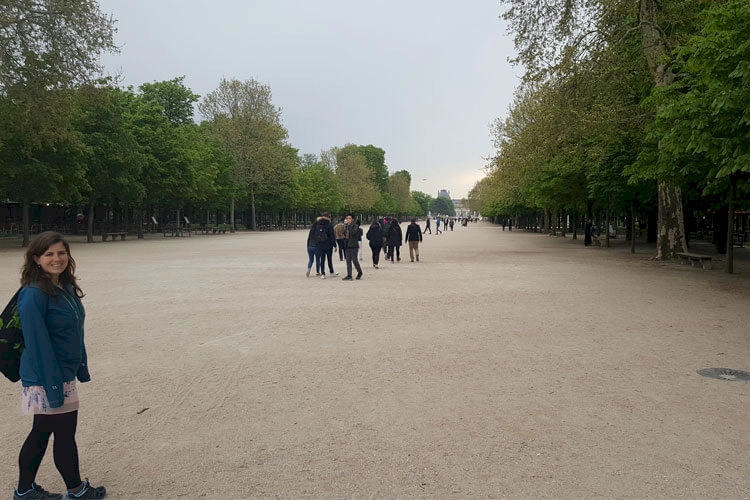 Zoe stood at the gardens in Paris