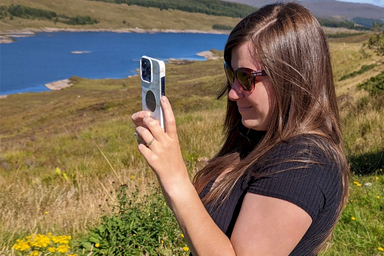 Zoe using her phone in Skye